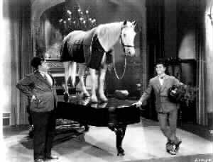 Laurel and Hardy with horse on piano